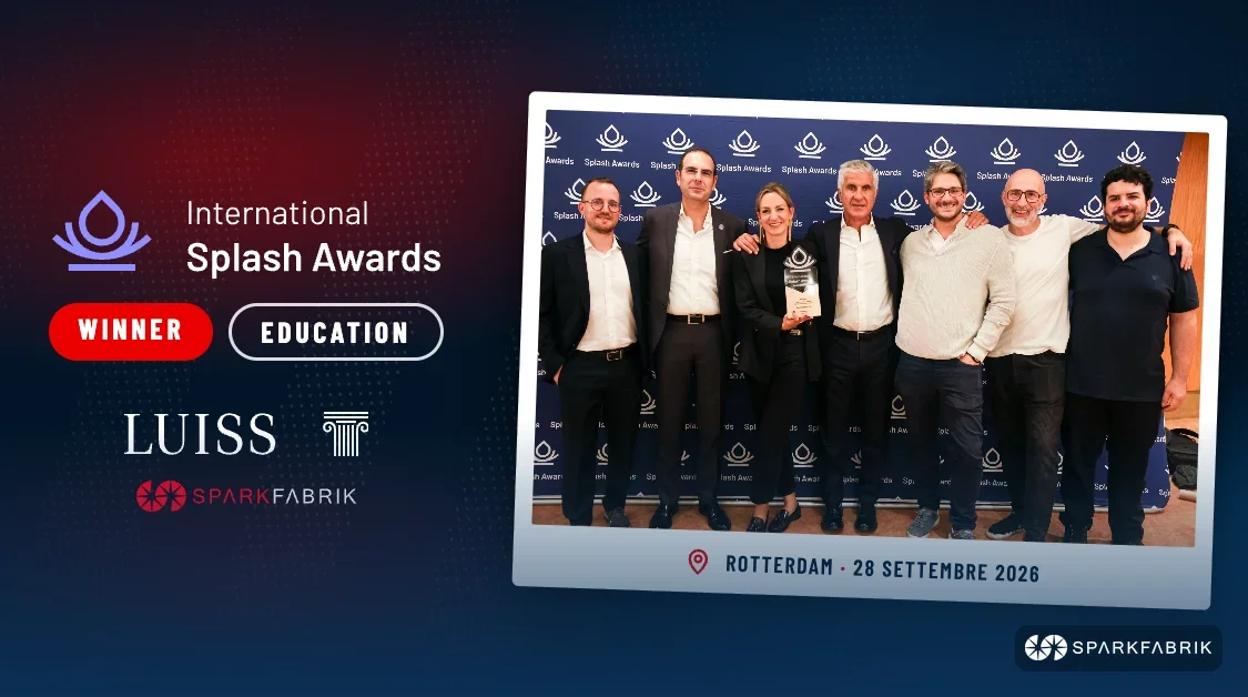 A group holds a trophy next to text reading "International Splash Awards Winner Education" and logos for Luiss and SparkFabrik.